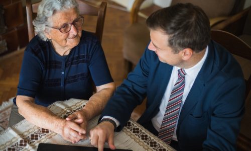 An attorney helping a woman reopen an insurance storm damage claim.